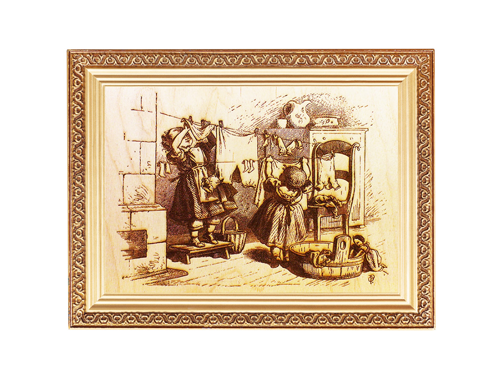 激光雕刻掛在木頭上的娃娃衣服照片